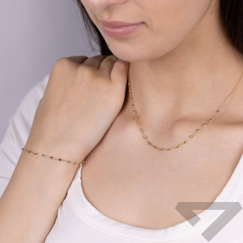 Naszyjnik złoty z grawerowanymi walcami