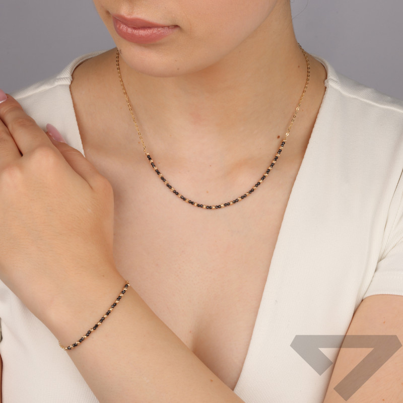 Bransoleta złota z czarnymi i złotymi kulkami/rolo M3-282 BL próba 585