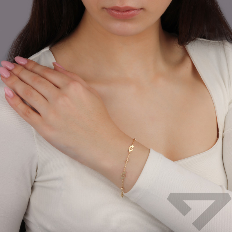 Bransoleta złota splecione serca i grawerowane kulki