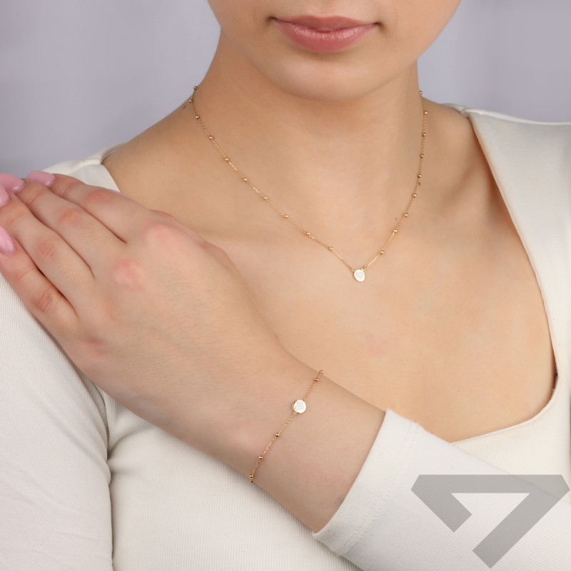 Bransoleta złota serce z białą masą perłową i kulki/rolo MI 90467-90401 próba 375