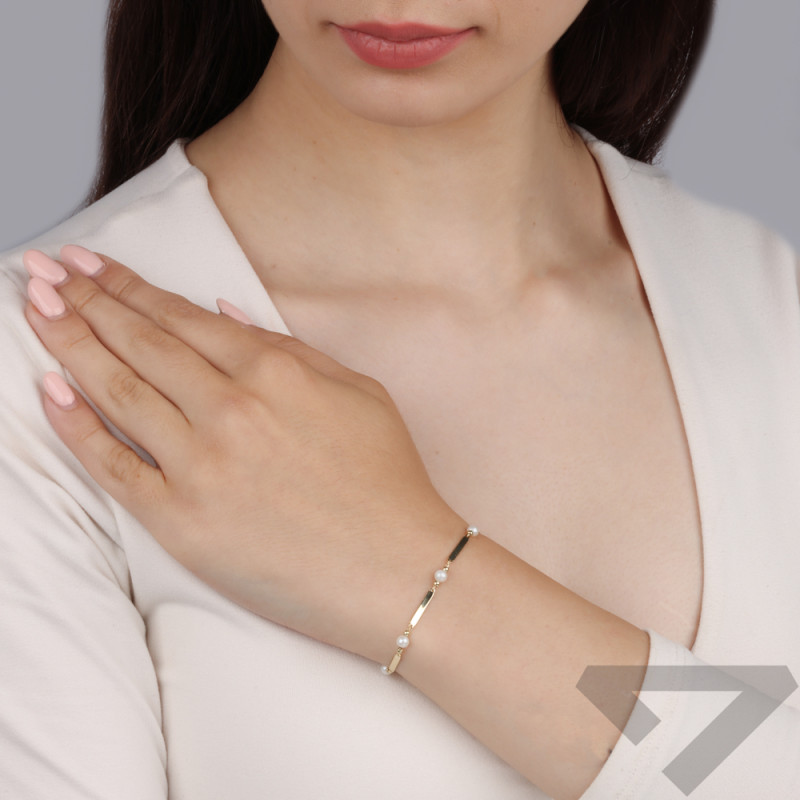 Bransoleta złota z białymi perłami i gładkimi blaszkami próba 375