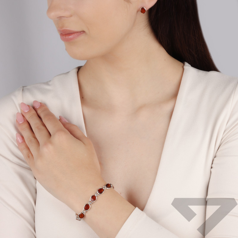 Kolczyki srebrne z okrągłym bursztynem koniakowym/sztyft MG 173-koniakowy próba 925