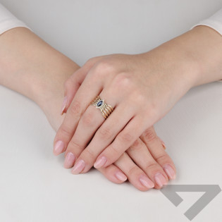 Pierścionek złoty ażurowa szyna z szafirową cyrkonią próba 375