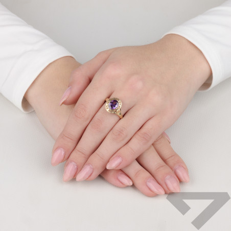 Pierścionek złoty z fioletową cyrkonią w koszyczku próba 585