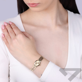 Zegarek złoty z owalną tarczą i greką