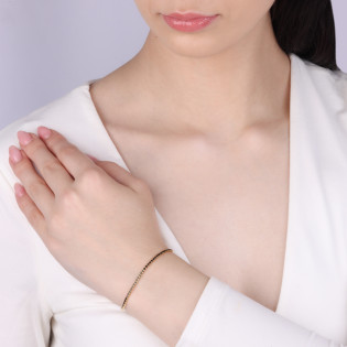 Bransoleta pozłacana z czarnymi cyrkoniami w rzędzie