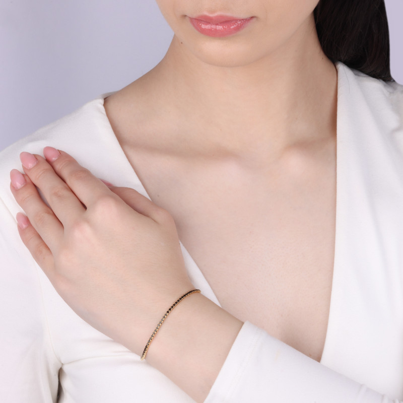 Bransoleta pozłacana z czarnymi cyrkoniami w rzędzie