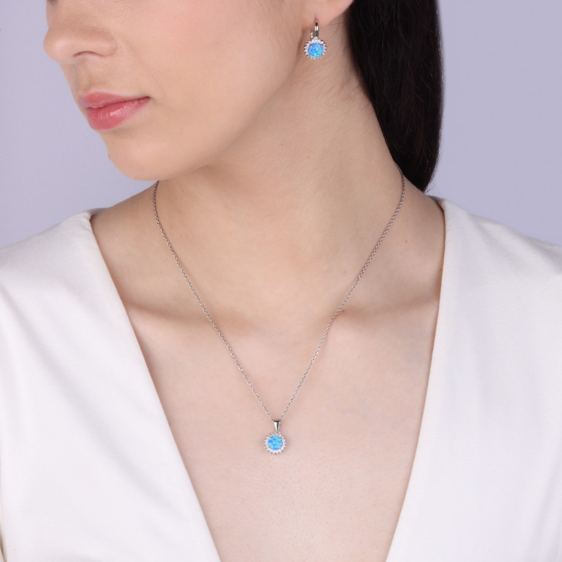 Komplet srebrny kolczyki i zawieszka kwiat z niebieskim opalem