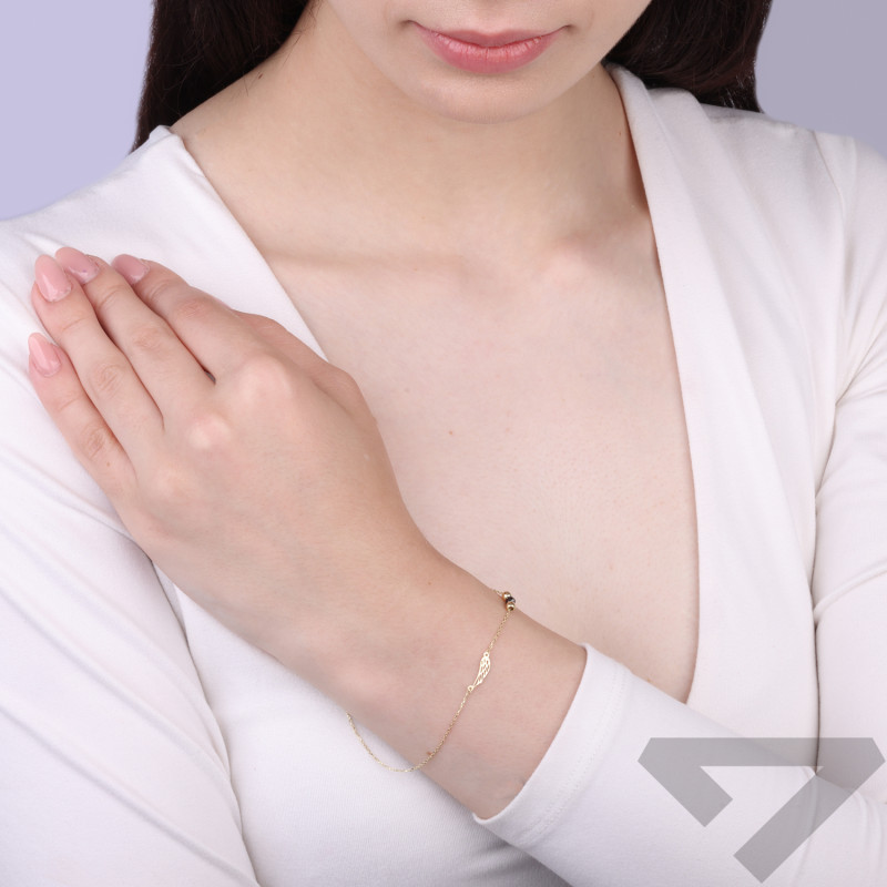 Bransoleta złota ażurowe skrzydło i czarna fasetowana kulka próba 375