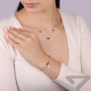 Naszyjnik srebrny koloru złotego z ażurowym kolibrem i kulkami faset