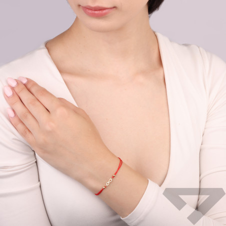 Bransoletka na sznurku koloru czerwonego z nieskończonością ze złota