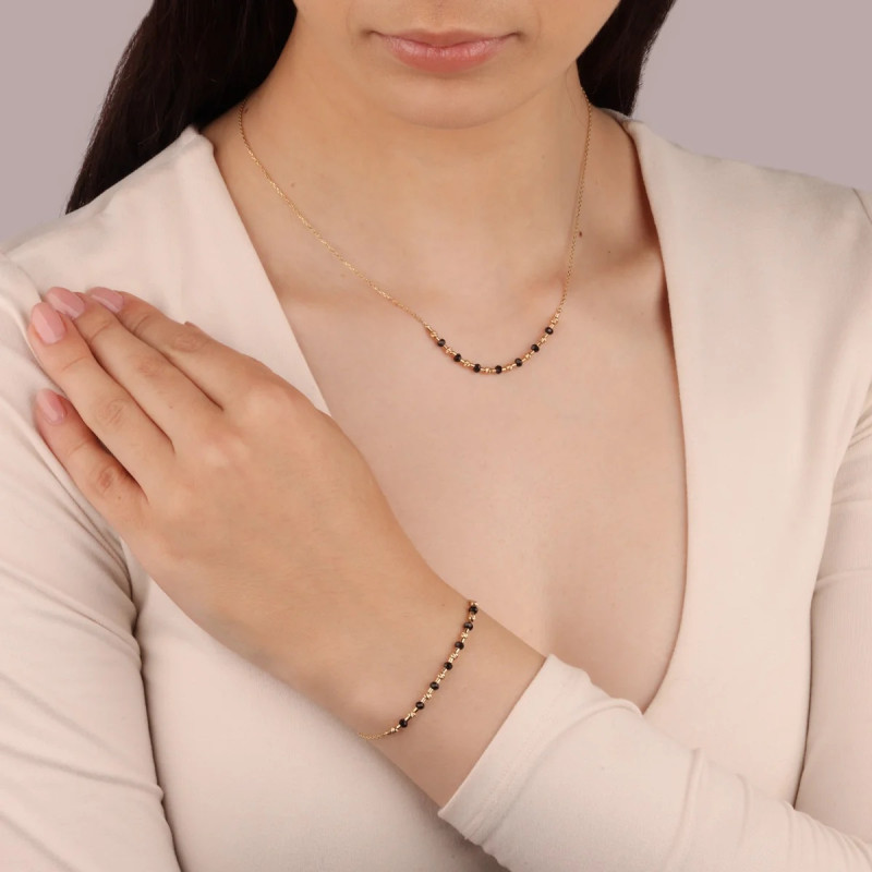 Bransoletka złota kulki czarne faset i kulki złote grawer