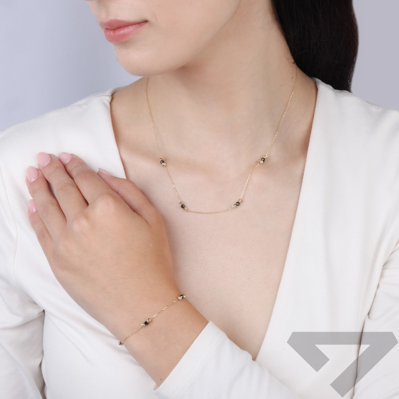 Naszyjnik złoty cyrkonia czarna faset i kulki grawerowane