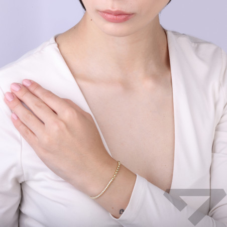 Bransoletka z cyrkoniami tennis i kulkami gładkimi srebro próba 925 kolor złoty