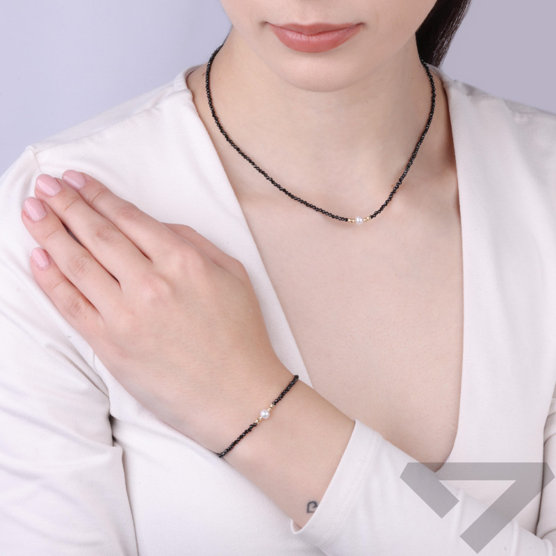 Bransoletka złota z czarnymi spinelami i perłą, próba 585