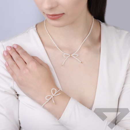 Naszyjnik z perłami i kokardką, srebro 925 koloru złotego