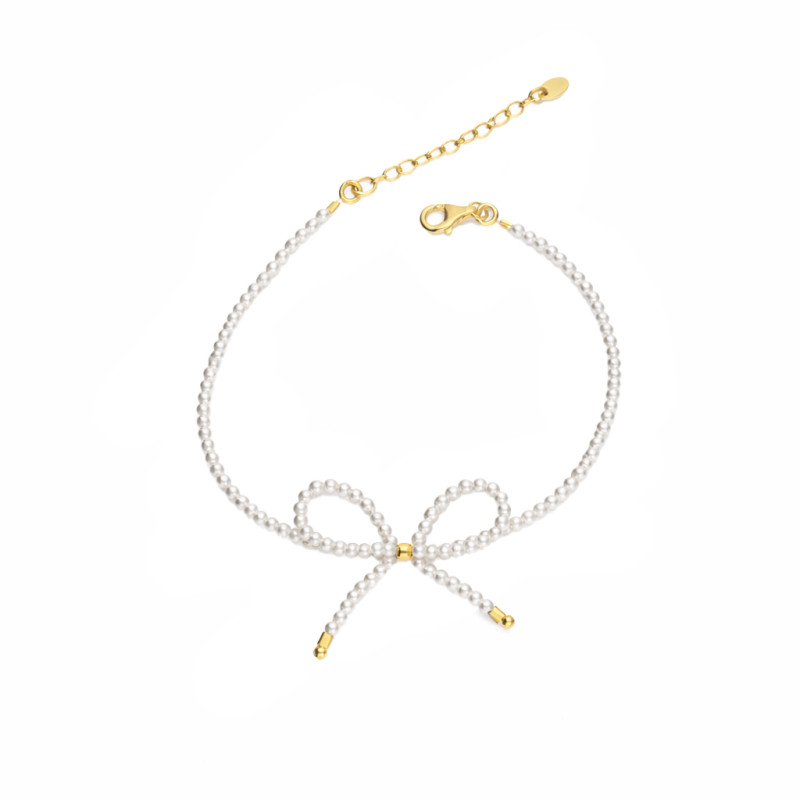 Bransoletka z perłami i kokardą, elementy koloru złotego ze srebra 925
