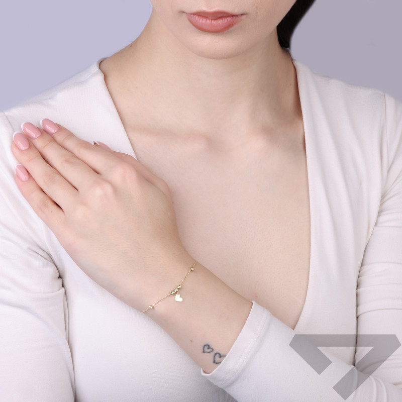 Bransoleta złota wiszące serce bokiem i grawerowane kulki próba 375