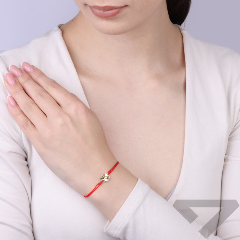 Bransoletka sznurkowa koloru czerwonego ze złotym aniołkiem próby 585