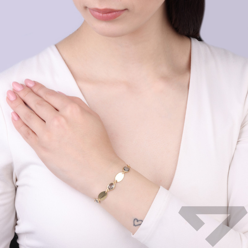 Bransoletka srebrna koloru złotego z szarymi cyrkoniami fasetowanymi, próba 925