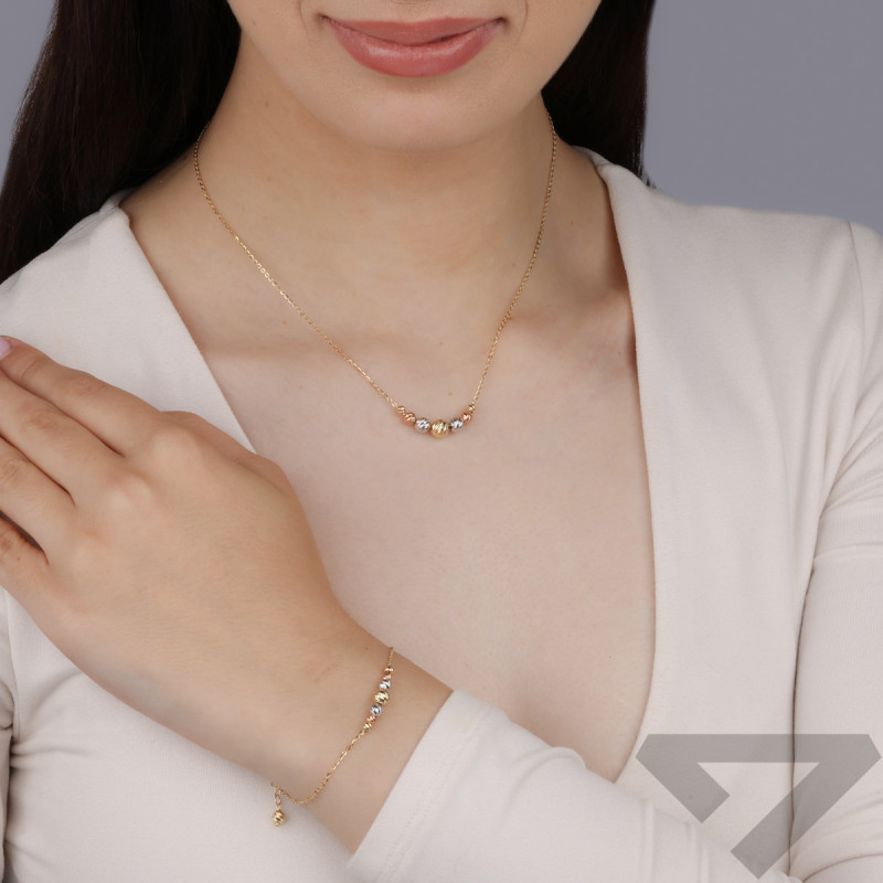 Naszyjnik w trzech kolorach złota 14 karat z diamentowanymi kulkami