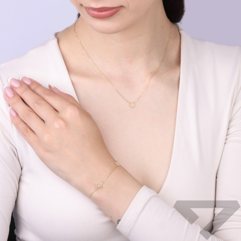 Bransoletka złota próby 585 z ażurowymi koniczynami na łańcuszku